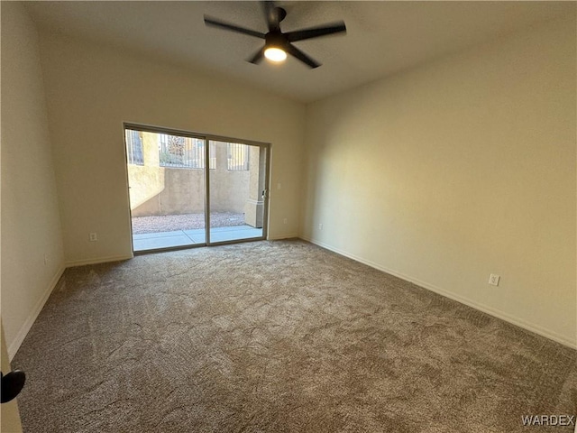 empty room featuring carpet, baseboards, and a ceiling fan