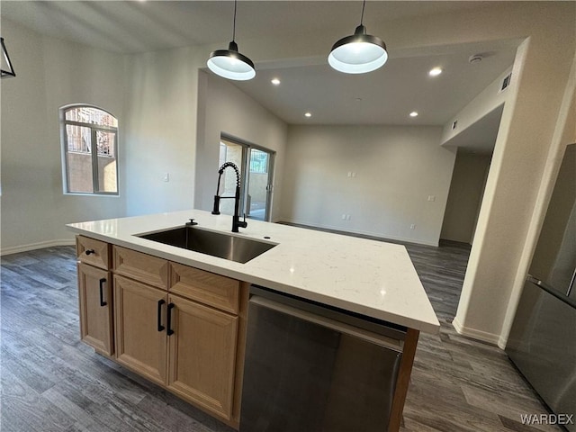 kitchen with dishwasher, a center island with sink, a sink, and decorative light fixtures