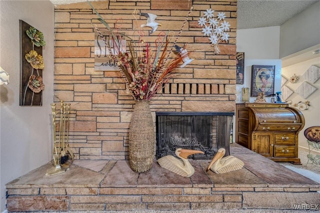 interior details with a fireplace and a textured ceiling