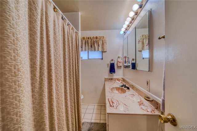 full bathroom featuring a shower with shower curtain, tile patterned flooring, and vanity