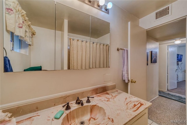 full bathroom with vanity and visible vents