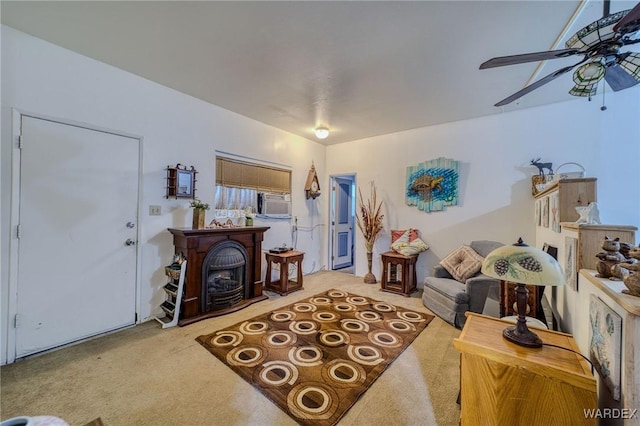 carpeted living room with a ceiling fan