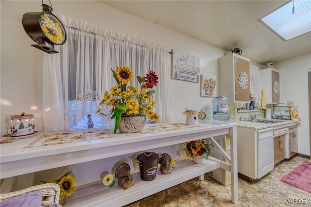 details featuring white cabinets and light countertops