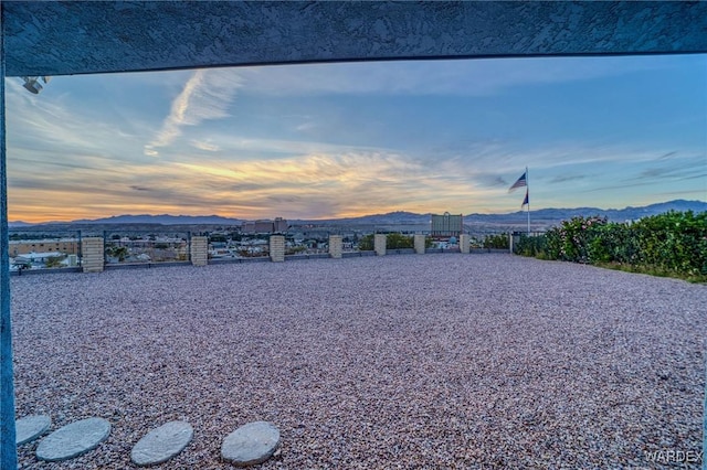 view of front of house with a mountain view and a flat roof