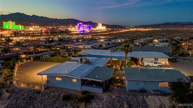 birds eye view of property featuring a mountain view