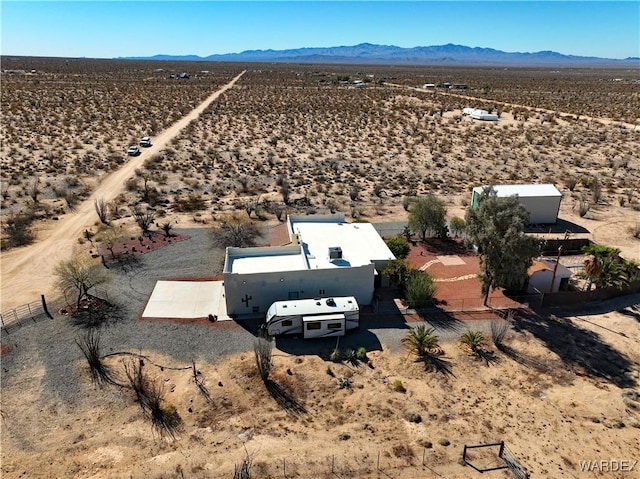 bird's eye view with a mountain view and a desert view