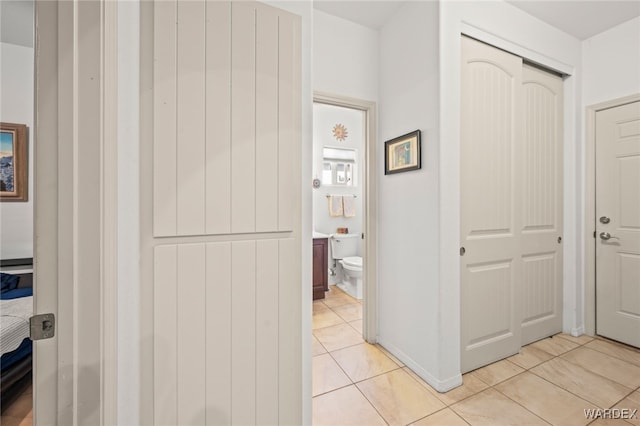 corridor with light tile patterned flooring