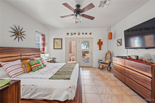 bedroom with access to exterior, light tile patterned flooring, visible vents, and ceiling fan