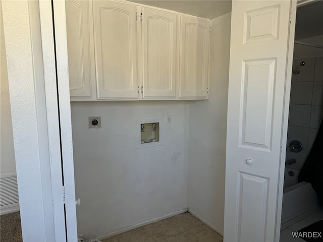 laundry area with washer hookup, hookup for an electric dryer, baseboards, and light tile patterned floors