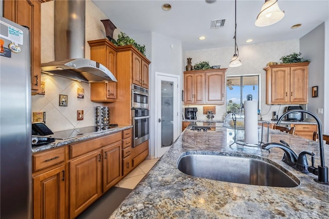 1878 E Fairway Bnd, Fort Mohave, AZ 86426 - kitchen with wall chimney range hood, appliances with stainless steel finishes, dark stone countertops, tasteful backsplash, and decorative light fixtures
