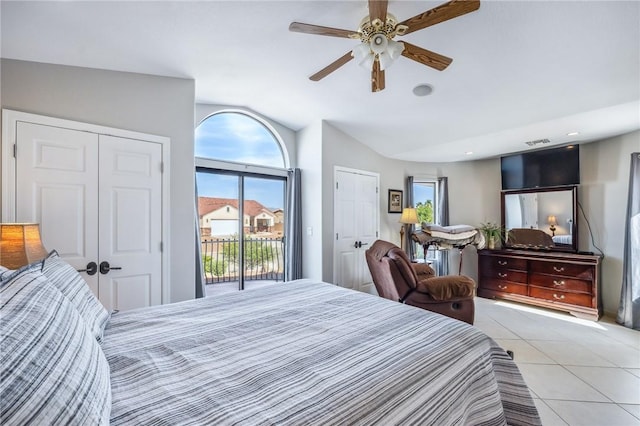 1878 E Fairway Bnd, Fort Mohave, AZ 86426 - bedroom featuring access to exterior, lofted ceiling, light tile patterned floors, and a ceiling fan