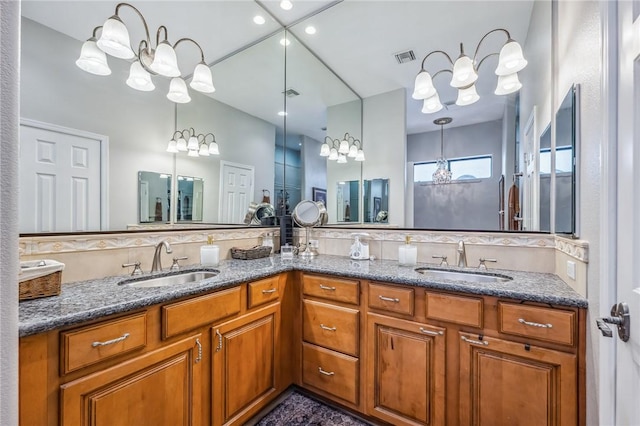 1878 E Fairway Bnd, Fort Mohave, AZ 86426 - bathroom with a chandelier, double vanity, and tasteful backsplash