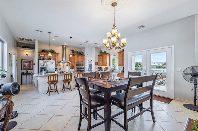 1878 E Fairway Bnd, Fort Mohave, AZ 86426 - dining room featuring french doors, a chandelier, light tile patterned floors, recessed lighting, and a water view