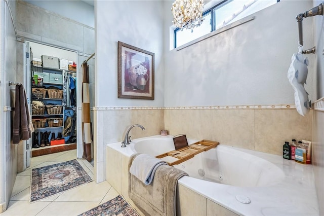 1878 E Fairway Bnd, Fort Mohave, AZ 86426 - bathroom featuring a chandelier, a stall shower, tile patterned floors, and a whirlpool tub
