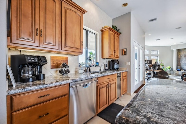 1878 E Fairway Bnd, Fort Mohave, AZ 86426 - kitchen featuring dishwasher, dark stone counters, tasteful backsplash, brown cabinetry, and open floor plan