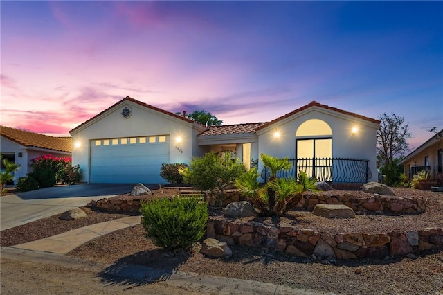 1878 E Fairway Bnd, Fort Mohave, AZ 86426 - view of front of property featuring a tile roof, a garage, concrete driveway, and stucco siding