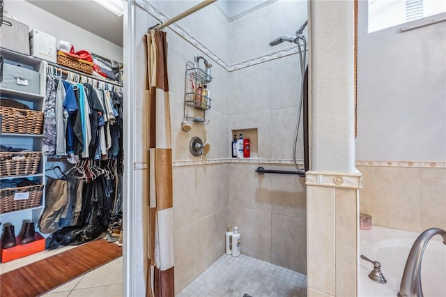 1878 E Fairway Bnd, Fort Mohave, AZ 86426 - full bath with a tile shower, a bath, a walk in closet, and tile patterned floors