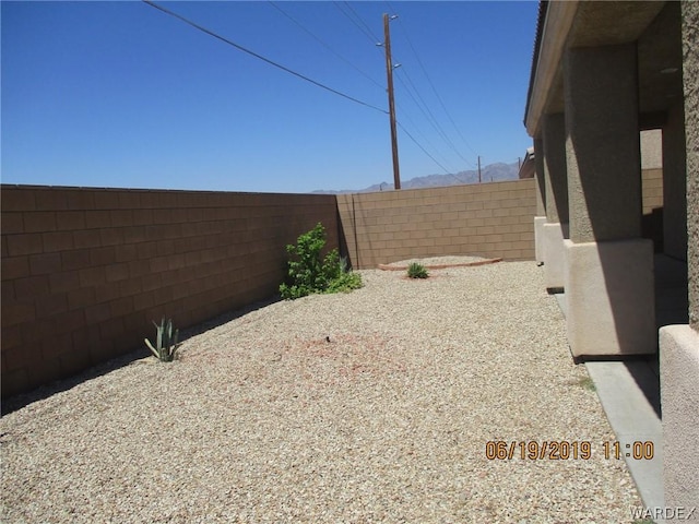 view of yard with a fenced backyard and a patio