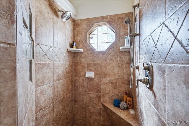 bathroom with a tile shower