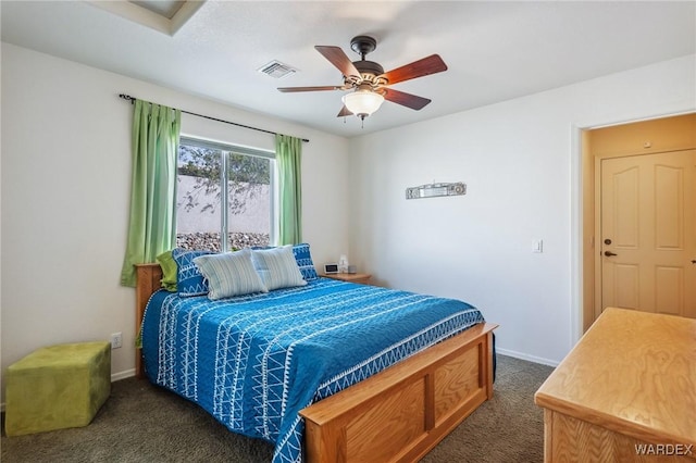 bedroom featuring ceiling fan, baseboards, visible vents, and dark carpet