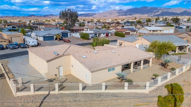 drone / aerial view featuring a residential view and a mountain view