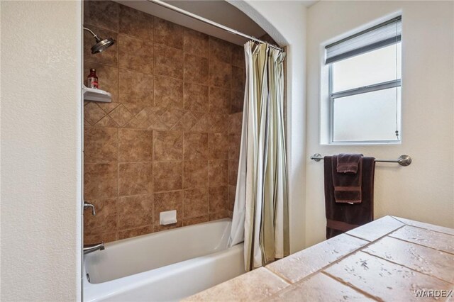 bathroom with shower / tub combo