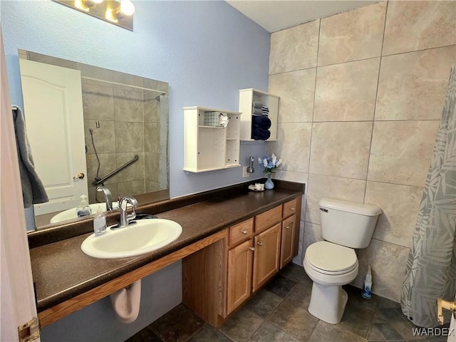bathroom featuring tile walls, vanity, toilet, and a shower with shower curtain
