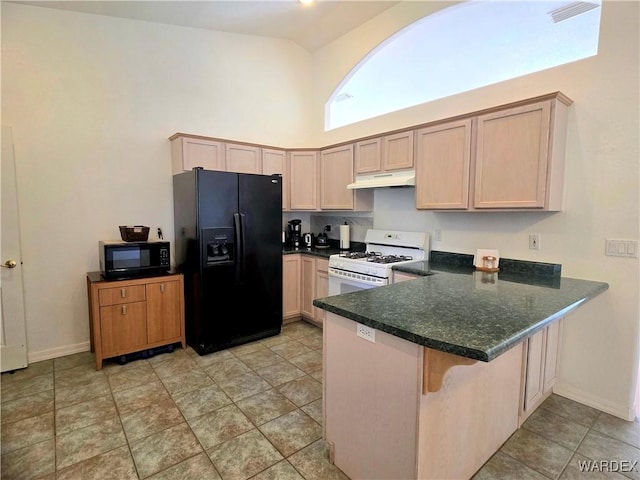 kitchen featuring high vaulted ceiling, a peninsula, baseboards, under cabinet range hood, and black appliances