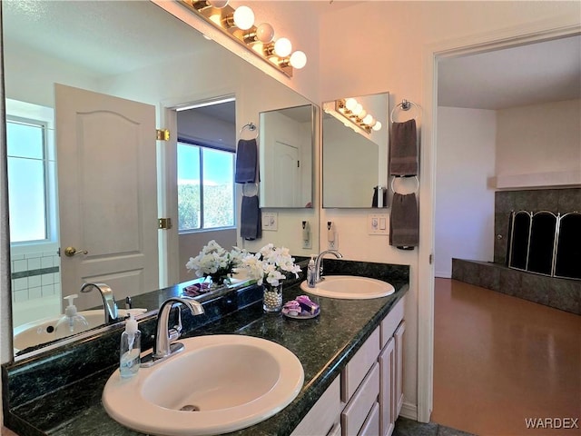 bathroom with double vanity and a sink