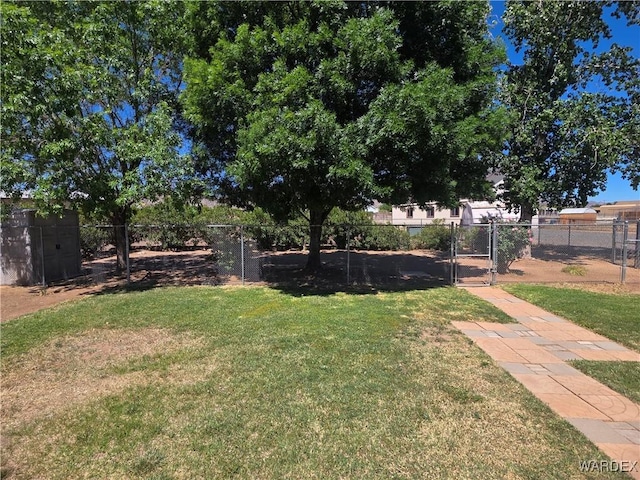 view of yard featuring fence and a gate
