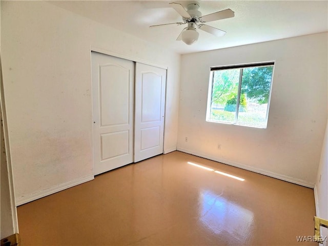 unfurnished bedroom with a closet, baseboards, and ceiling fan