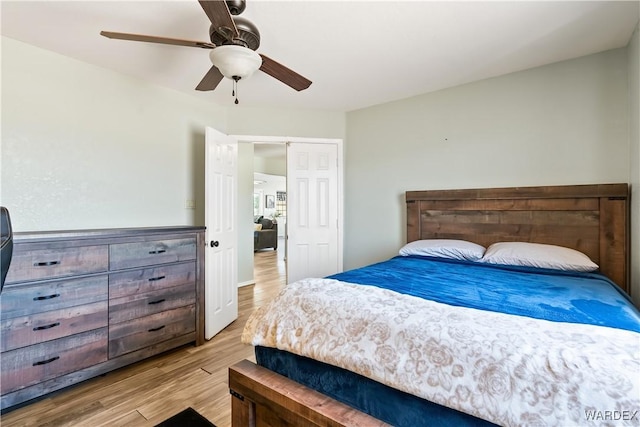 bedroom with ceiling fan and wood finished floors