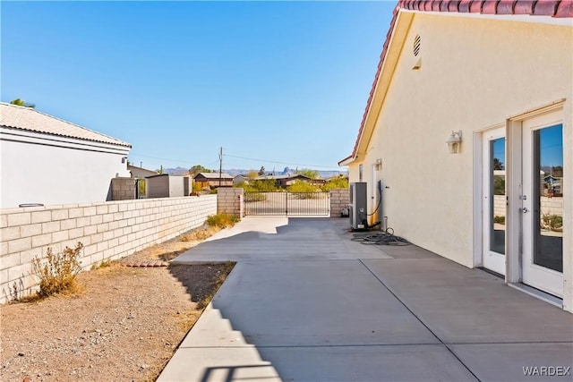 view of yard with a patio area, a gate, and fence