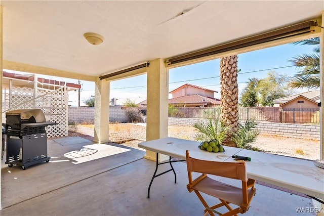 view of patio / terrace featuring outdoor dining space, a fenced backyard, and a grill