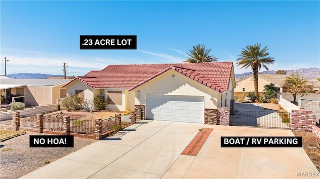 mediterranean / spanish-style home with an attached garage, driveway, fence, and stucco siding