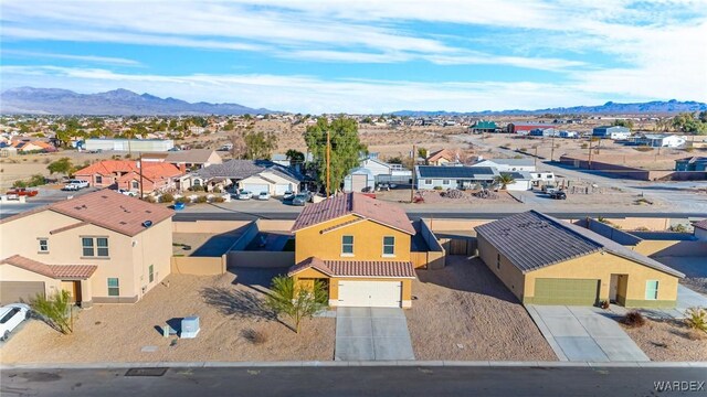 bird's eye view featuring a residential view and a mountain view