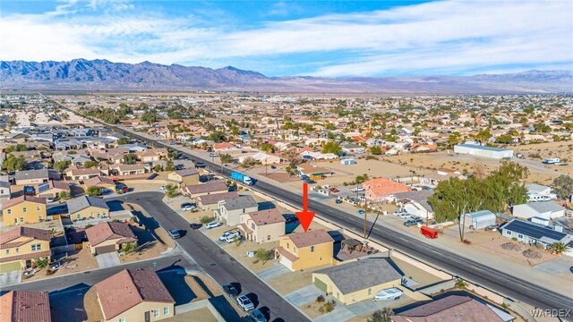 bird's eye view featuring a residential view and a mountain view