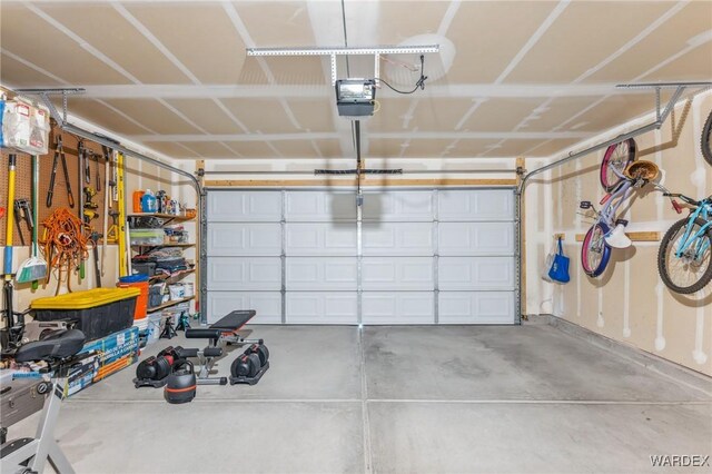 garage featuring a garage door opener