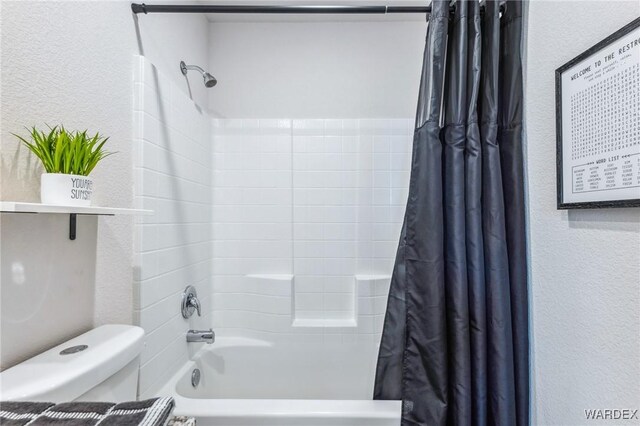 full bath featuring toilet, shower / tub combo, and a textured wall