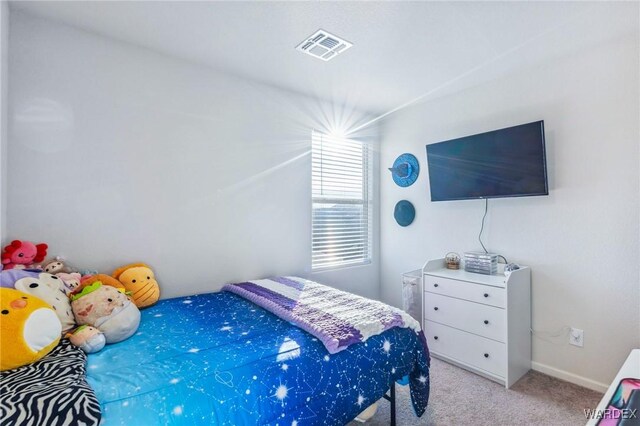 bedroom featuring light carpet and visible vents