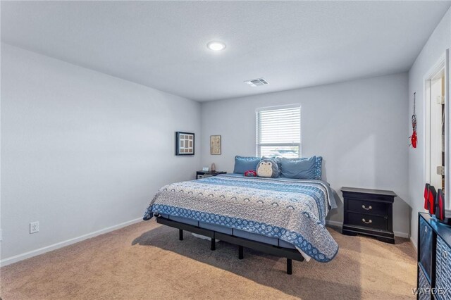 bedroom featuring carpet, visible vents, and baseboards