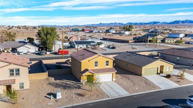 birds eye view of property featuring a residential view and a mountain view