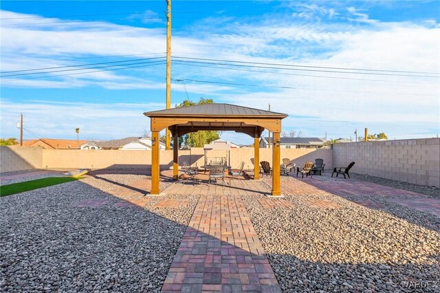 view of patio / terrace with a fenced backyard and a gazebo