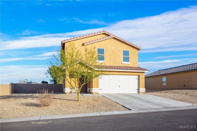 view of front of property with a garage, a tiled roof, concrete driveway, and stucco siding