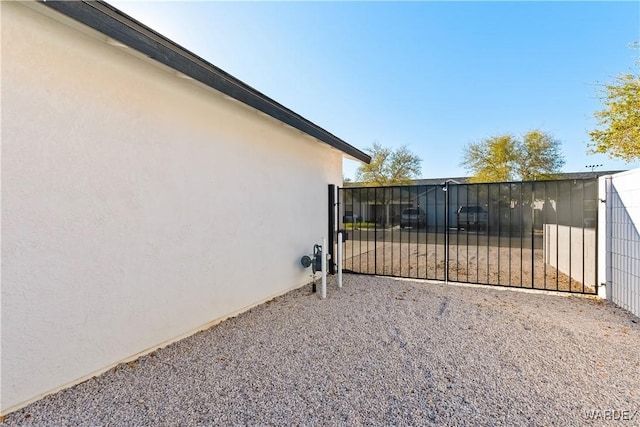 view of gate with fence