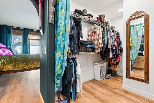 spacious closet with wood finished floors