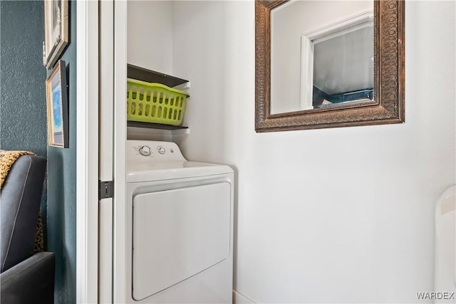 washroom with laundry area and washer / clothes dryer