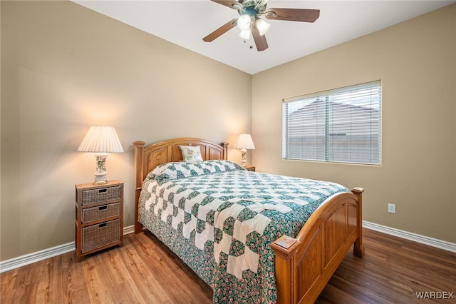 bedroom with wood finished floors, baseboards, and ceiling fan