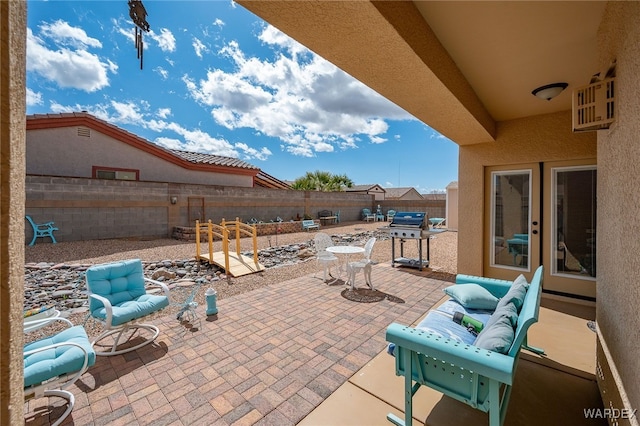 view of patio with a fenced backyard and a grill