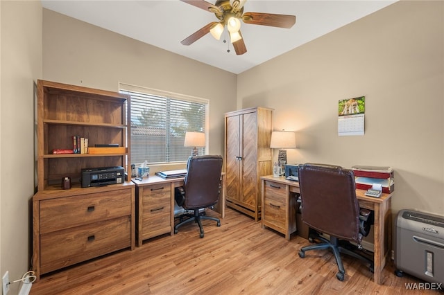 home office with a baseboard radiator, light wood-type flooring, and ceiling fan